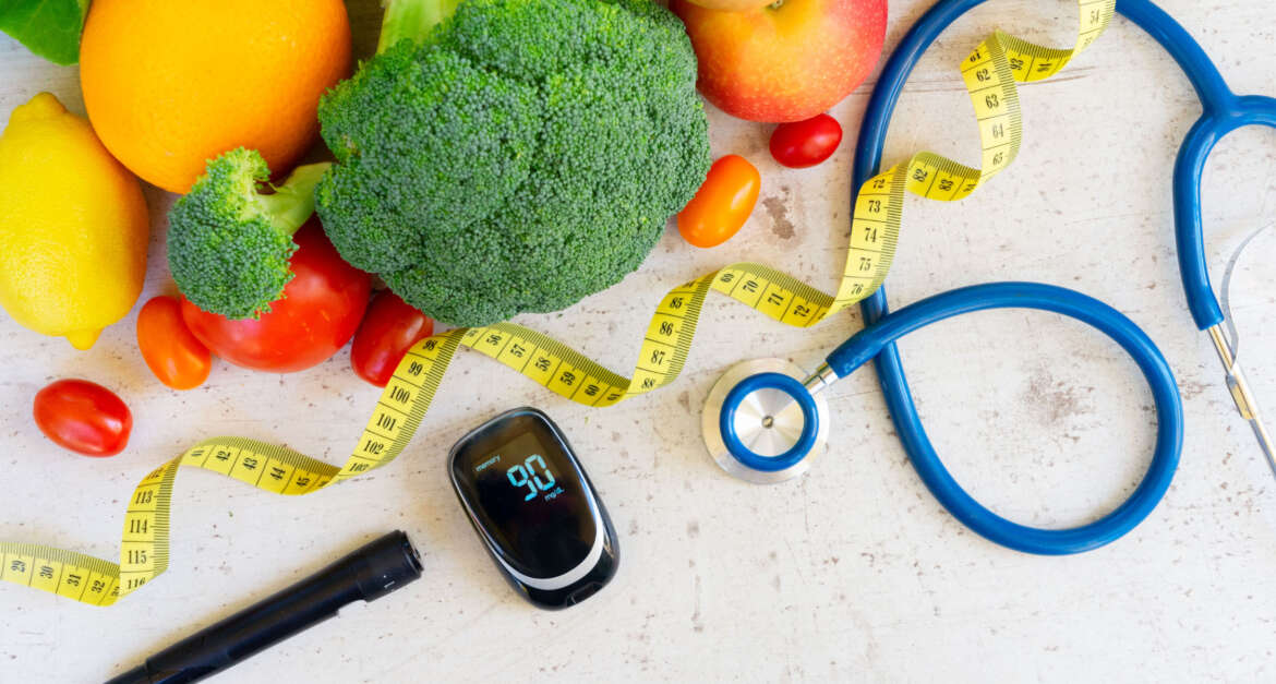 Healthy foods laid out with medical equipment