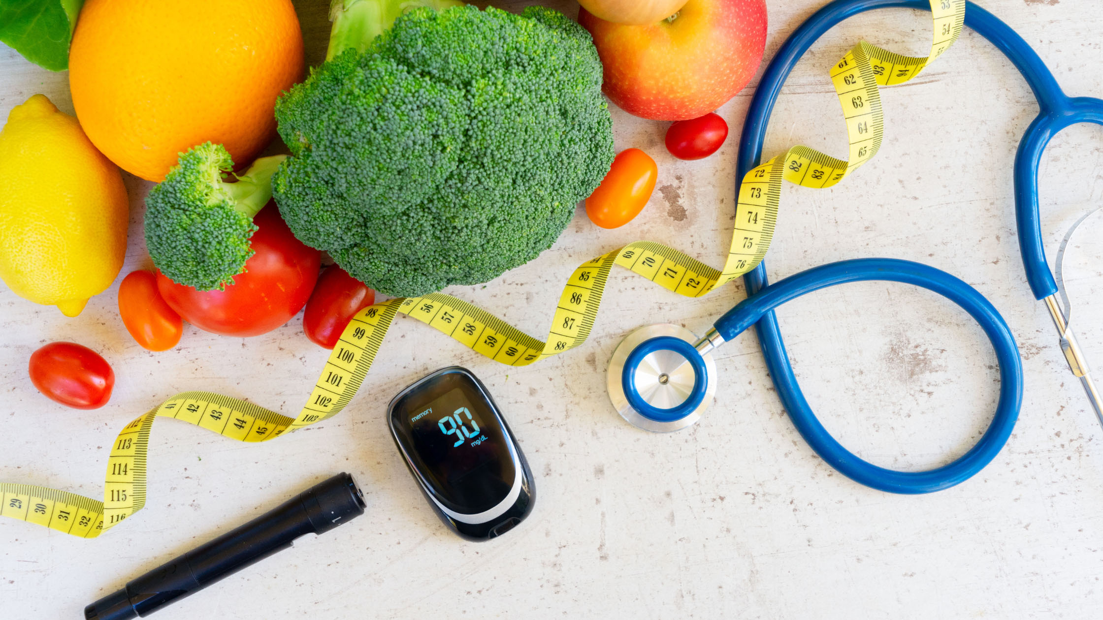 Healthy foods laid out with medical equipment
