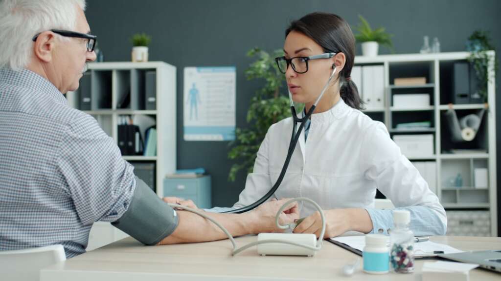 photo-1758691462413-b07dee2933fejpg - Barbour Orthopaedics & Spine Doctor conducting thorough medical examination with patient during first visit consultation
