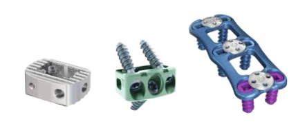 Three hardware components: a metal block, a green screw-terminal block, and a blue cable carrier with rollers.