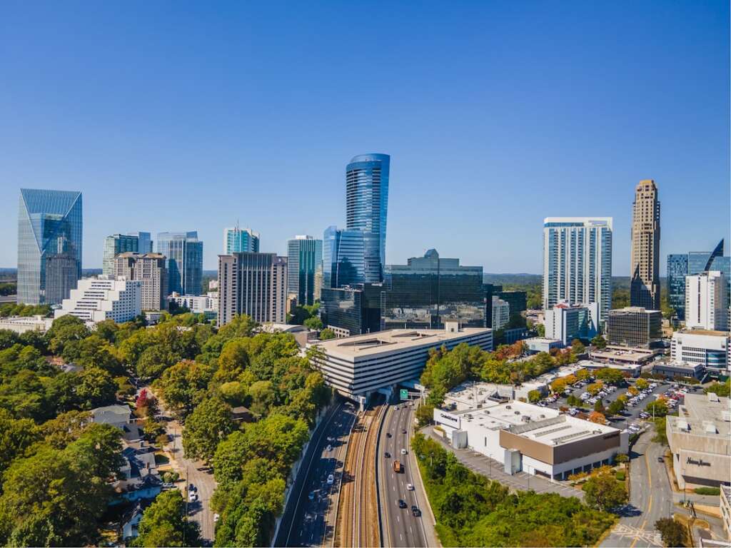 Aerial view of Atlanta, Georgia skyline with lush trees and highways — local orthopaedic care
